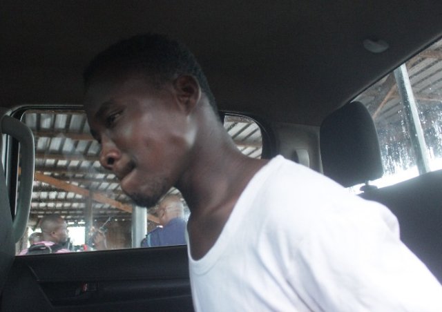 Suspect Shadrack Hushie after he was arrested by the police