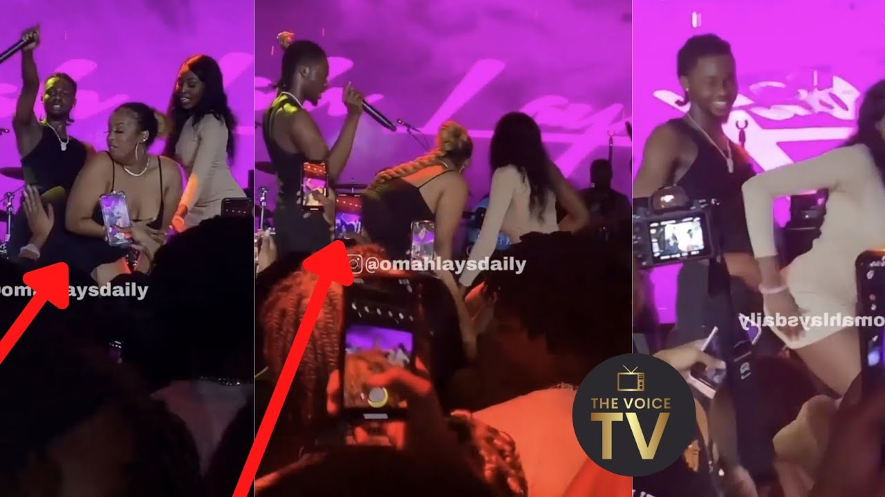 Omah Lay dancing with fan's girlfriend